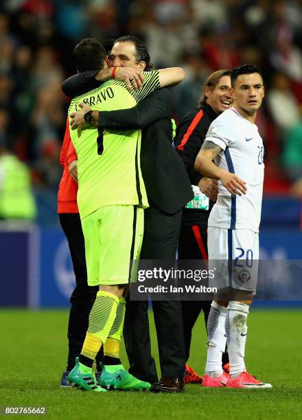 Claudio Bravo of Chile and Juan Antonio Pizzi of Chile celebrate after the FIFA Confederations Cup Russia 2017 Semi-Final between Portugal and Chile...