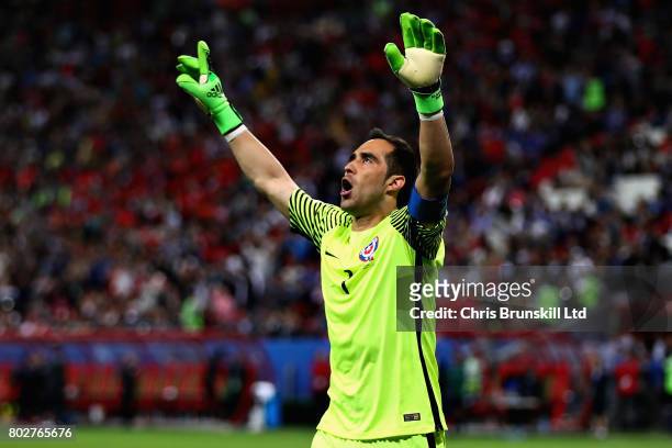 Claudio Bravo of Chile celebrates after saving a penalty in the shoot out during the FIFA Confederations Cup Russia 2017 Semi-Final between Portugal...