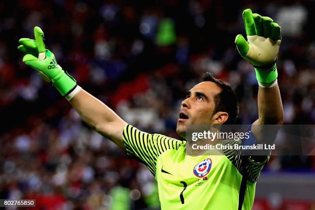 Claudio Bravo of Chile celebrates after saving a penalty in the shoot out during the FIFA Confederations Cup Russia 2017 Semi-Final between Portugal...