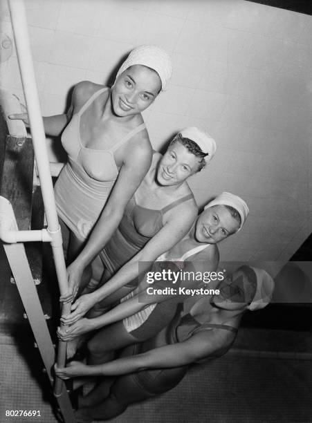 American divers in training for the 1948 London Olympics at Epsom baths, Surrey, 21st July 1948. Left to right; Vickie Draves, Juno Stover-Irwin, Zoe...