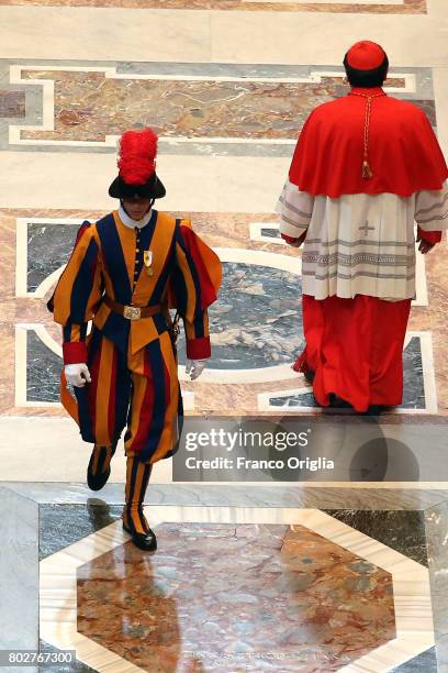 Cardinal and a Swiss guard walk through the central navata of St. Peter's Basilica during a consistory on June 28, 2017 in Vatican City, Vatican....