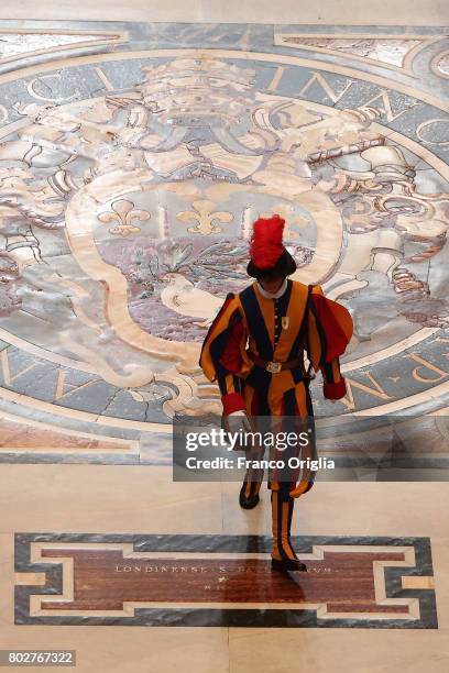 Swiss guard walks through the central navata of St. Peter's Basilica during a consistory on June 28, 2017 in Vatican City, Vatican. Pope Francis...