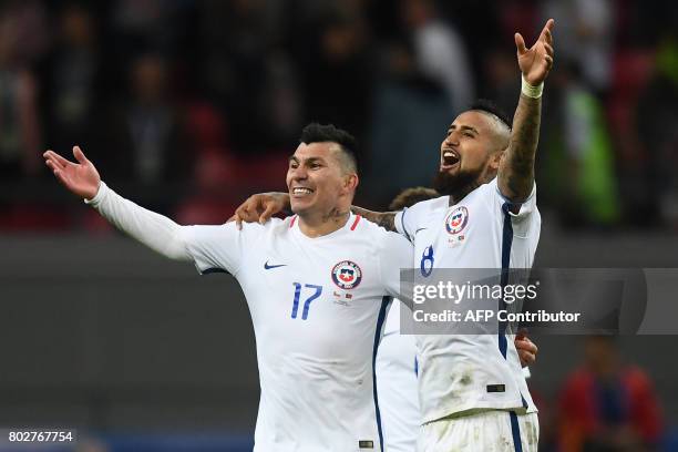 Chile's defender Gary Medel and Chile's midfielder Arturo Vidal celebrate after Chile won the 2017 Confederations Cup semi-final football match...
