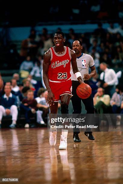 Michael Jordan of the Chicago Bulls dribbles upcourt during his rookie season in 1984 in Chicago, Illinois. NOTE TO USER: User expressly acknowledges...