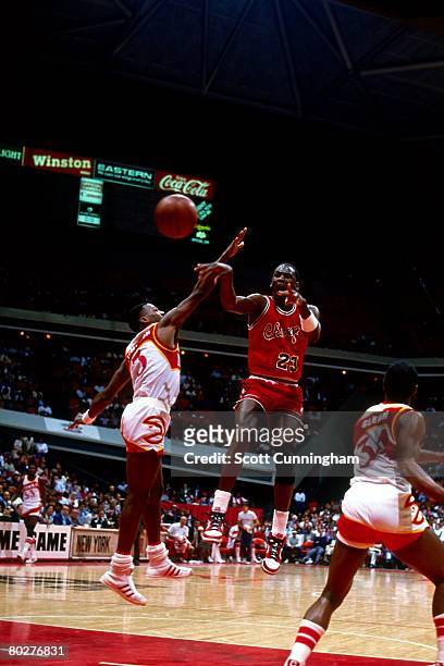 Michael Jordan of the Chicago Bulls passes against the Atlanta Hawks during his rookie season of 1984 at the Omni in Atlanta, Georgia. NOTE TO USER:...