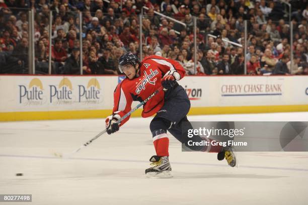 Alex Ovechkin of the Washington Capitals shoots the puck against the Calgary Flames at the Verizon Center on March 12, 2008 in Washington, DC.