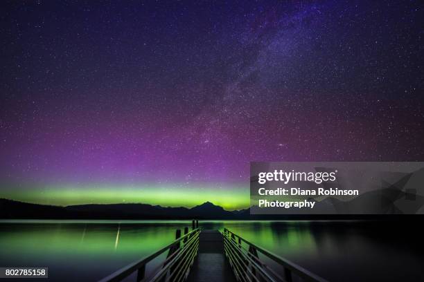 northern lights and milky way over lake mcdonald, glacier national park, montana - parque nacional glacier fotografías e imágenes de stock