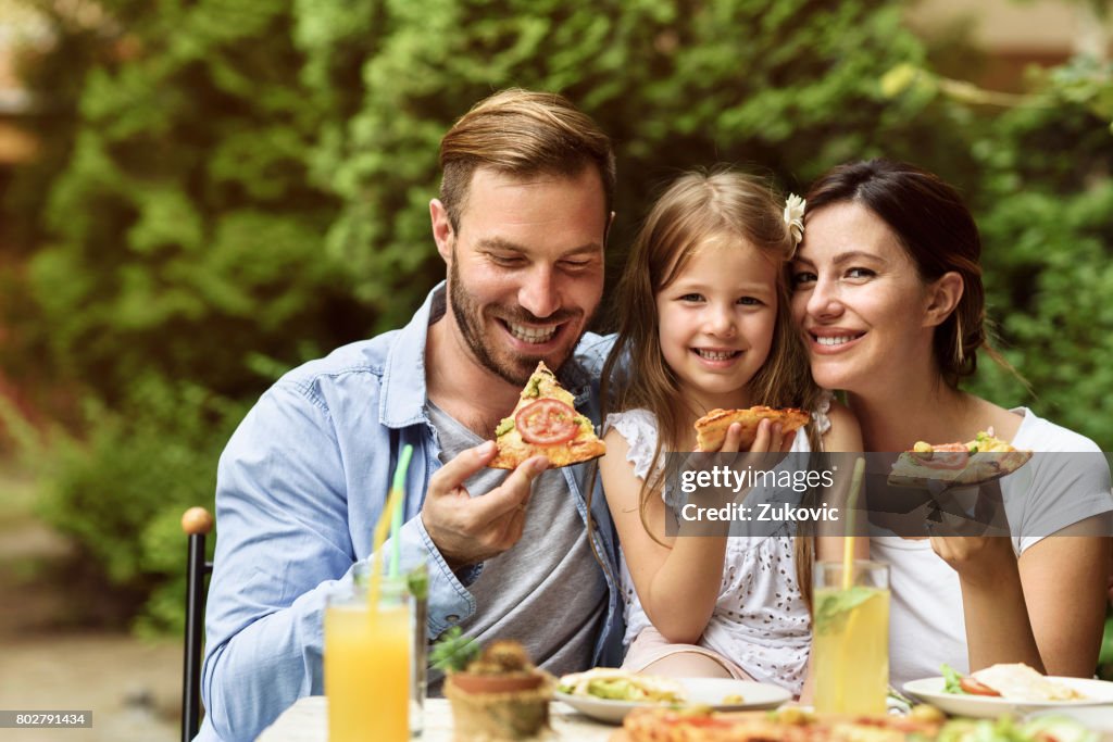 Happy Family eating outdoors