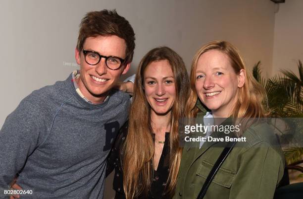 Eddie Redmayne, Hannah Bagshawe and Sarah Burton attend The Art Of Curating Fashion with Andrew Bolton presented by Sarabande: The Lee Alexander...