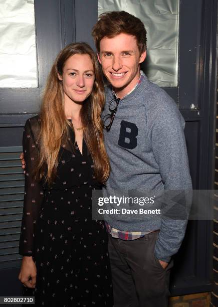 Eddie Redmayne and Hannah Bagshawe attend The Art Of Curating Fashion with Andrew Bolton presented by Sarabande: The Lee Alexander McQueen Foundation...