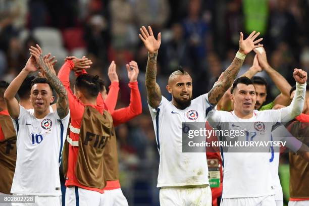 Chile's forward Martin Rodriguez , midfielder Arturo Vidal and defender Gary Medel celebrate after Chile won the 2017 Confederations Cup semi-final...