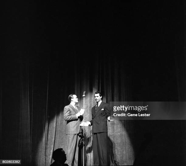 Actors Bob Hope and Cary Grant perform onstage as part of the Hollywood Victory Caravan which was a group of stars who toured 13 US cities to raise...