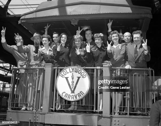 Charles Boyer;Joan Bennett;Desi Arnaz;Eleanor Powell;Joan Middleton;Claudette Colbert;Rise Stevens;Bert Lahr;Frank McHugh performing at the LA train...