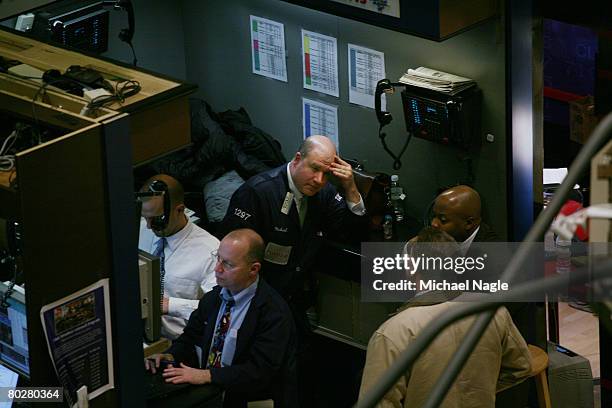 Traders work the floor of the New York Stock Exchange on March 17, 2008 in New York City. Stocks have been volatile on Wall Street following news of...