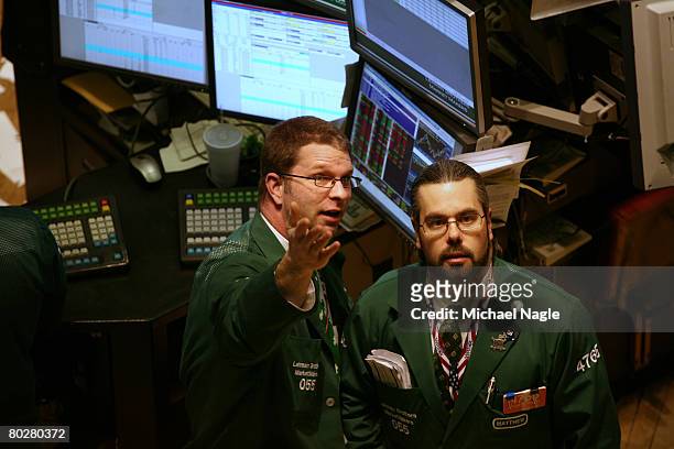 Traders work the floor of the New York Stock Exchange on March 17, 2008 in New York City. Stocks have been volatile on Wall Street following news of...