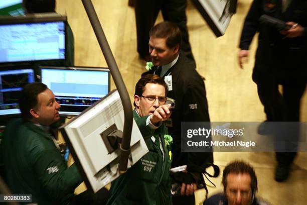 Traders work the floor of the New York Stock Exchange on March 17, 2008 in New York City. Stocks have been volatile on Wall Street following news of...