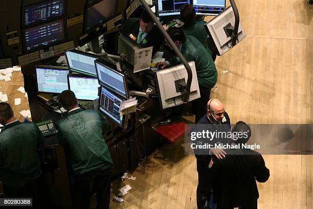 Traders work the floor of the New York Stock Exchange on March 17, 2008 in New York City. Stocks have been volatile on Wall Street following news of...