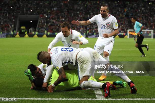 Claudio Bravo of Chile celebrates with Gary Medel and his team-mates after they won a penalty shootout during the FIFA Confederations Cup Russia 2017...