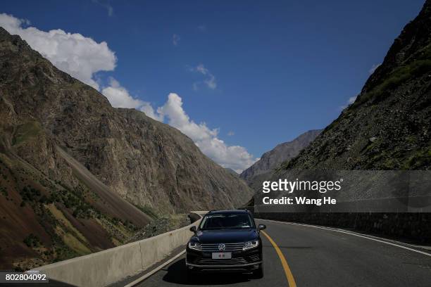 Car makes its way on the Duku highway on June 28.2017 in Xinjiang Uygur Autonomous Region, China. The Duku highway from Dushanzi to Kuche is 561 km....