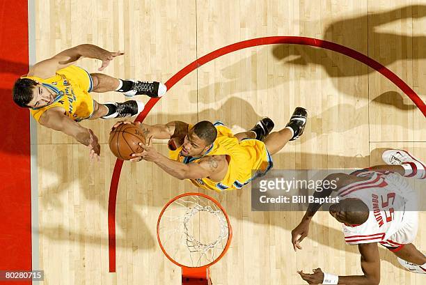 Tyson Chandler of the New Orleans Hornets grabs a rebound during the game against the Houston Rockets on March 8, 2008 at the Toyota Center in...