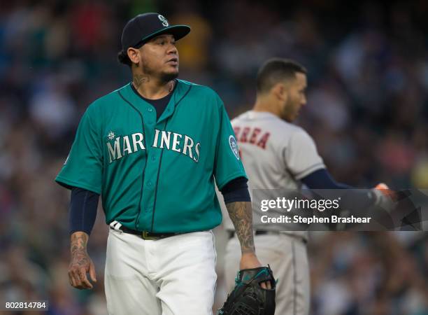 Starting pitcher Felix Hernandez of the Seattle Mariners walks off the field after pitching during a game against the Houston Astros at Safeco Field...