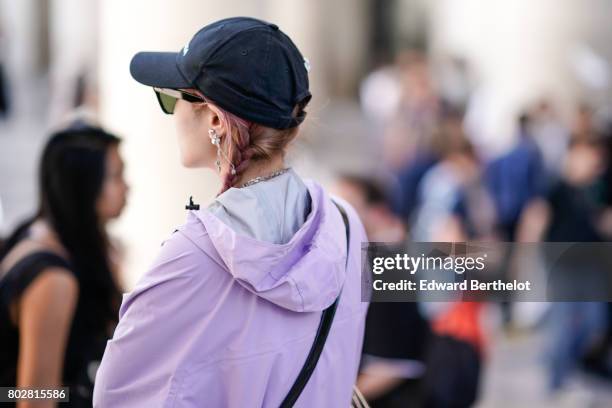 Guest wears a cap and a pink jacket, outside the 22/4 Hommes show, during Paris Fashion Week - Menswear Spring/Summer 2018, on June 23, 2017 in...