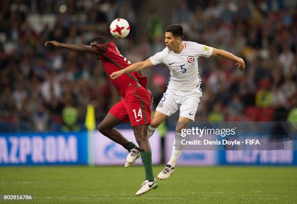 William of Portugal battles for the ball against Francisco Silva of Chile during the FIFA Confederations Cup semi-final match between Portugal and...