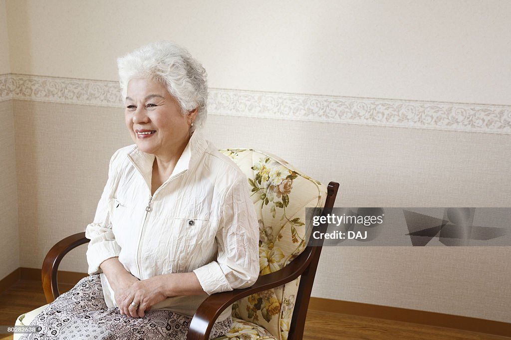 A Senior Adult Woman Sitting on Chair