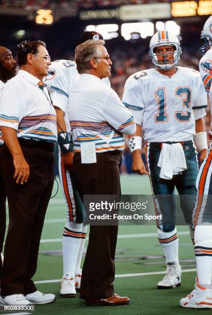 Quarterback Dan Marino of the Miami Dolphins talks with head coach Don Shula during an NFL football game circa 1992. Marino played for the Dolphins...