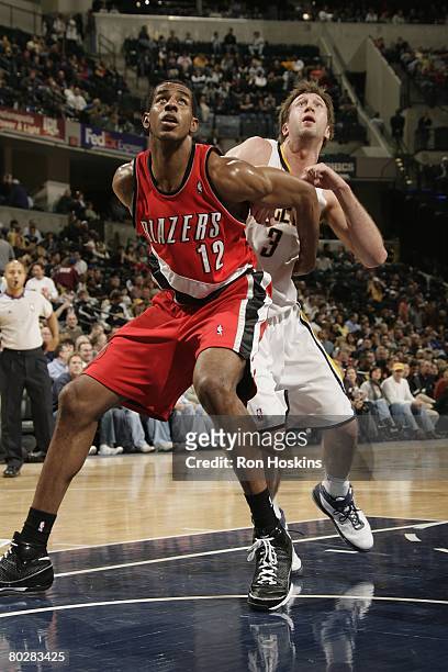 LaMarcus Aldridge of the Portland Trail Blazers rebounds against Troy Murphy of the Indiana Pacers during the game at Conseco Fieldhouse on February...