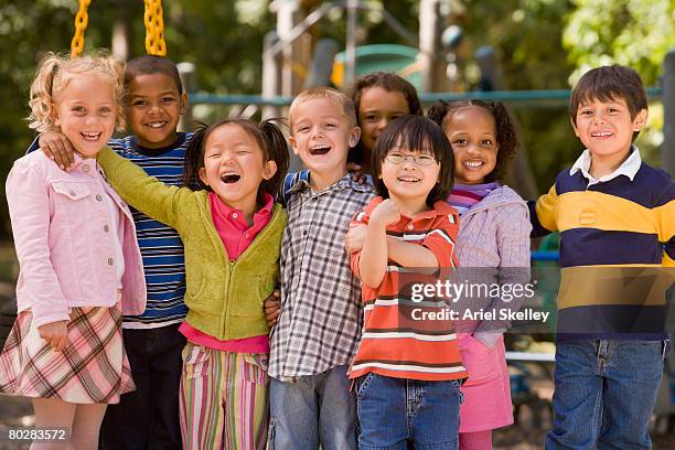 multi-ethnic children at playground - school playground stock-fotos und bilder