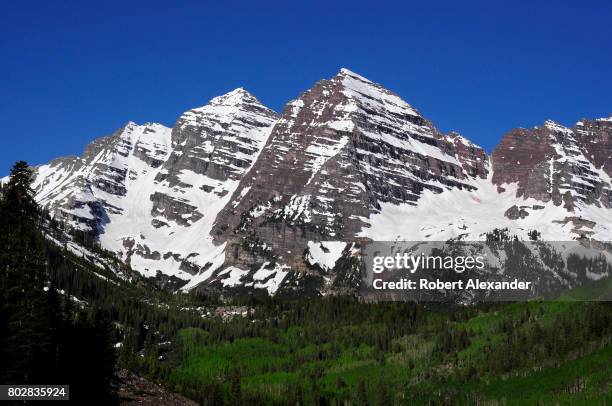 The Maroon Bells near Aspen, Colorado, are two peaks in the Elk Mountains - Maroon Peak and North Maroon Peak. They are located in the Maroon...