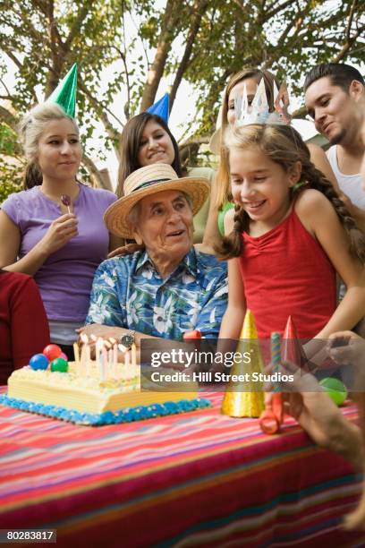 hispanic girl celebrating birthday with family - family vertical stock pictures, royalty-free photos & images