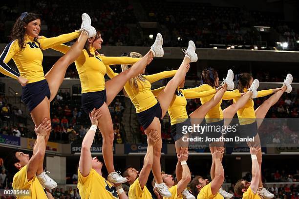 Cheerleaders from the Michigan Wolverines perform against the Wisconsin Badgers during the Big Ten Men's Basketball Tournament at Conseco Fieldhouse...