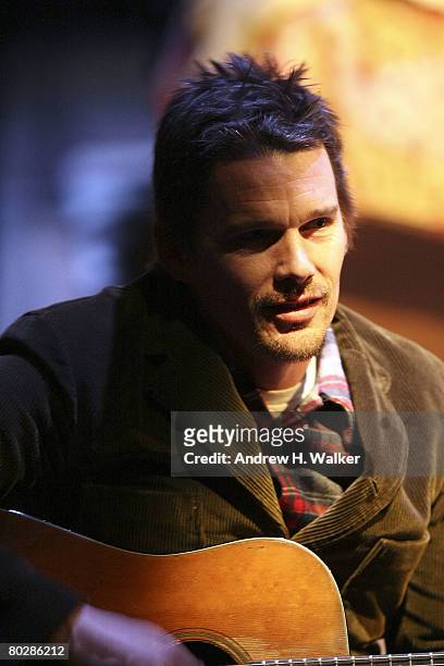 Actor Ethan Hawke sings and plays guitar between performances at the "24 Hour Plays" at the Atlantic Theater on March 17, 2008 in New York City.