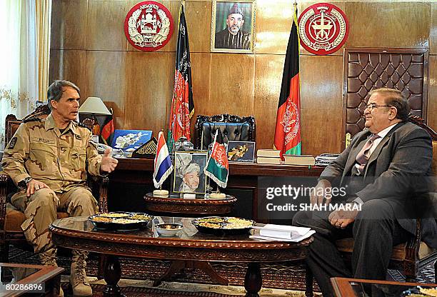 Netherlands Chief of Defence Staff General D.L. Berlijn gestures as he speaks with Afghan Defence Minister Abdul Rahim Wardak during a meeting at The...