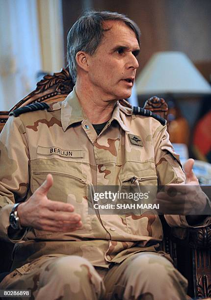 Netherlands Chief of Defence Staff General D.L. Berlijn gestures as he speaks with Afghan Defence Minister Abdul Rahim Wardak during a meeting at The...
