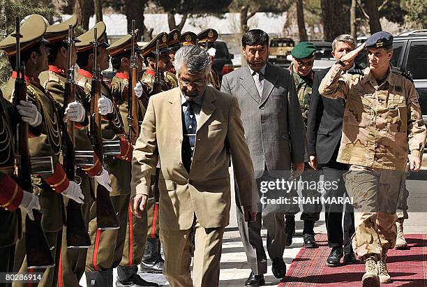 Netherlands Chief of Defence Staff General D.L. Berlijn salutes a guard of honour of Afghan troops as he arrives at The Defence Ministry in Kabul on...