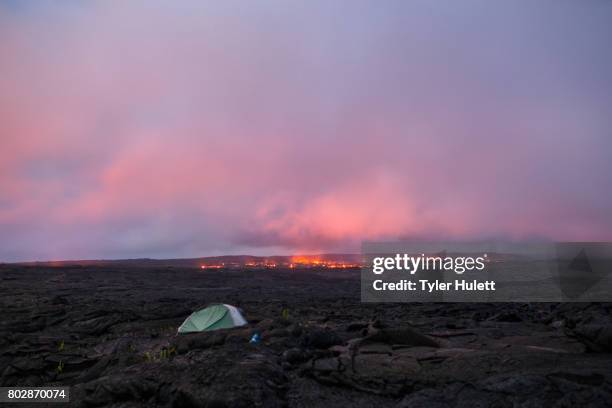 camping tent near lava flow at dusk - pele goddess stock pictures, royalty-free photos & images