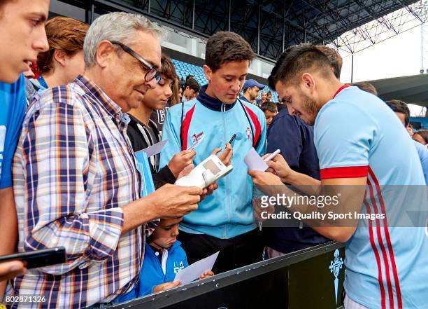 Maxi Gomez signs autographs during his presentation as a new player for Celta de Vigo at Estadio Balaidos on June 28, 2017 in Vigo, Spain.