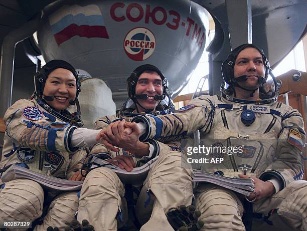 Astronauts So-Yeon Yi of South Korea , captain Sergei Volkov of Russia and Oleg Kononenko of Russia attend a training session in Star City outside...