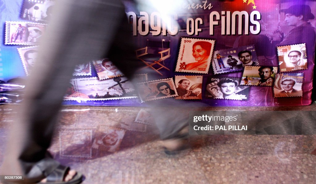An Indian stamp collector walk pass a po