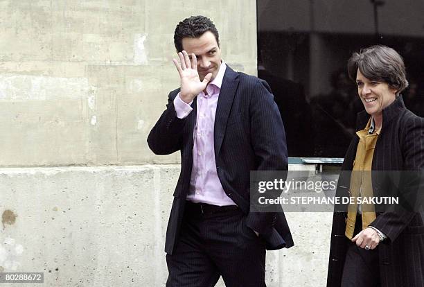 French rogue trader Jerome Kerviel gestures as he leaves "La Sante" prison with his lawyer Elisabeth Meyer, on March 18 2008 in Paris, after a Paris...