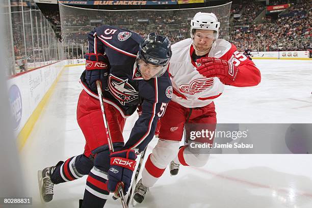 Niklas Kronwall of the Detroit Red Wings defends against Andrew Murray of the Columbus Blue Jackets on March 16, 2008 at Nationwide Arena in...