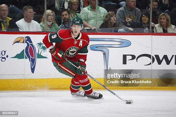 Mikko Koivu of the Minnesota Wild handles the puck against the Los Angeles Kings during the game at Xcel Energy Center on March 15, 2008 in Saint...