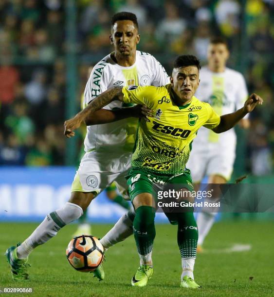 Lucas Mineiro of Chapecoense fights for the ball with Leonel Miranda of Defensa y Justicia during a first leg match between Defensa y Justicia and...