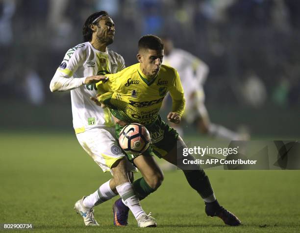 Brazil's Chapecoense defender Apodi vies for the ball with with Argentina's Defensa y Justicia defender Tomas Cardona during their Copa Sudamericana...