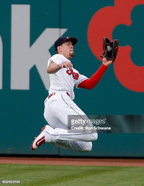 Bradley Zimmer of the Cleveland Indians makes a sliding catch to get out Shin-Soo Choo of the Texas Rangers during the fourth inning at Progressive...