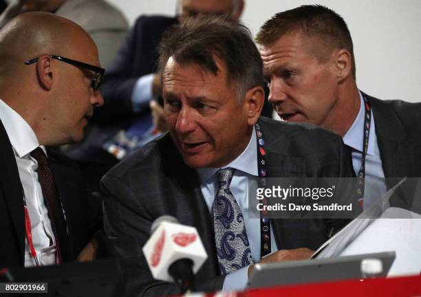 General manager Ken Holland of the Detroit Red Wings talks with his staff during the 2017 NHL Draft at United Center on June 24, 2017 in Chicago,...