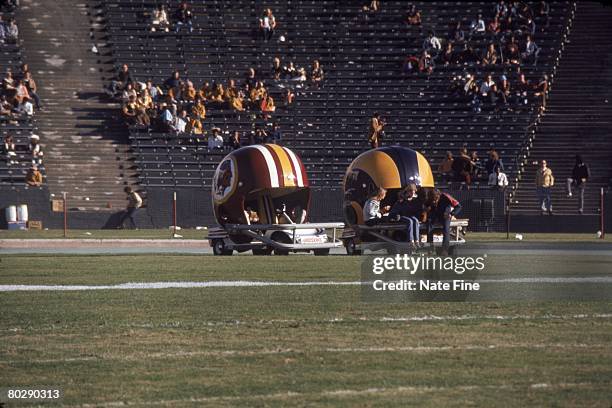 The Washington Redskins helmet cart is parked next to the Los Angeles Rams helmet cart prior to the 1974 NFC Divisional Playoff Game at the Los...